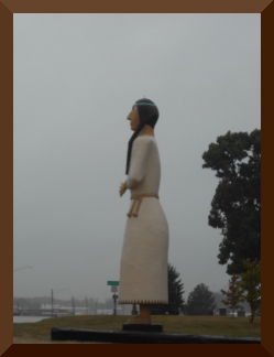 Painted wooden statue of Pocahontas about 15 feet high