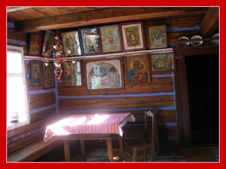 Early 20th century room, Eastern Slovakia, showing Greek Catholic icons
above dining table; Stara L'Ubovnia Skanzen