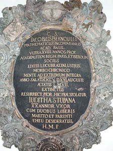 Against an oval marble background a bronze plaque in Latin commemorates Jacob Bernoulli who died in 1705
