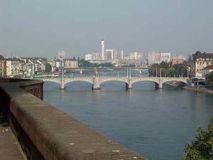 Taken from a walk overlooking the river, the photo shows the Rhine spanned by bridges with the skyscrapers of Basel in the distance