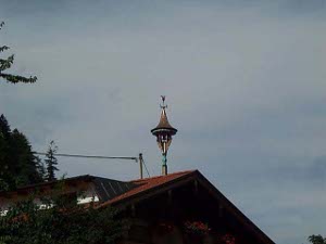 The roofs of many Tyrolean chalets bear an ornament consisting of a bell with a conical roof and a small weathervane on top