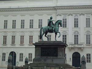 A copper green lifesize statue of a mounted nobleman at the Hofburg