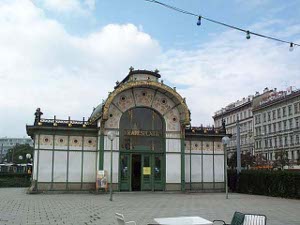 With white walls crossed with green lines, vertical and horizontal, and an arched entrance, the Karlsplatz subway station is a fine example of Viennese Jugendstil decoration