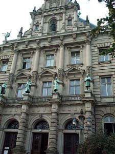 An elaborate stone multistory building decorated with allegorical statues