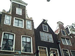 four houses are shown, with the typical beam and hoist arrangement to haul heavy articles to the upper floors