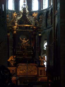 The dark marble altar is elaborately decorated in gold