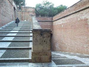 The steps are very wide, very long and somewhat shallow, gradually ascending the hill with surrounding brick walls