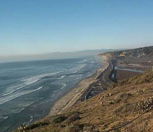From a bluff overlooking the Pacific can be seen miles of beach with gentle surf