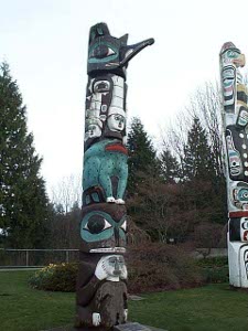 Colored black, white, brown, and turquoise, the totem was erected for the Burnaby Centennial