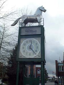The polished stainless beast appears to be a horse atop the clock tower