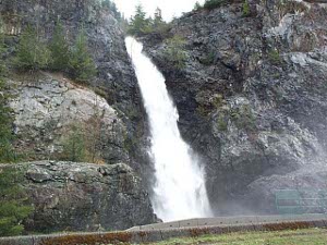 the water falls about 80 feet between two stone cliffs