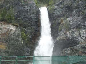 The water falls about 60 feet between two stone cliffs