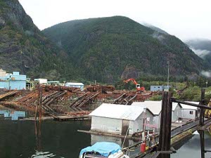 The waterfront facilities include a staging place to float logs for towing to market