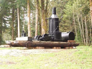 Nicely repainted black, the steam jenny sits on a massive log frame.