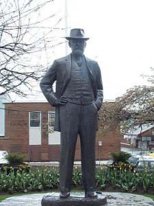 The lifesize bronze depicts Hayes wearing a three-piece suit with a hat, one hand in his pocket - clearly one in command.