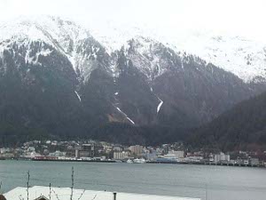 Juneau hugs the shore as if shrinking away from the towering mountains to the East