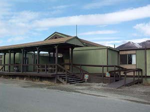 An olive green frame building with brown wooden porches, the park hotel is scheduled to be torn down and not replaced.