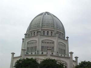 With a lacy appearance the temple has a dome atop an octagonal tower, colored taupe and gray green