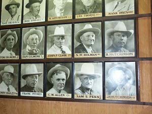 An exhibit in the museum shows the photographs of successful Miles City cattle ranchers, each wearing a western hat