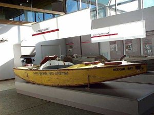 The small boat carried two rowers plus the expedition leader.  It is painted yellow, of shallow draft, with a sharply pointed end