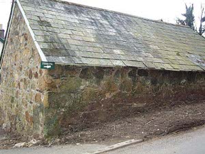 An old stone building with a slate roof in the area known as Pothole.
