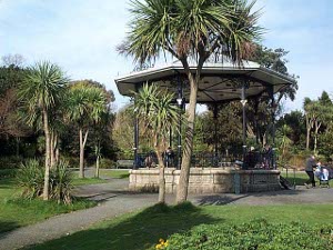 A number of tree yuccas surround the stone bandstand.