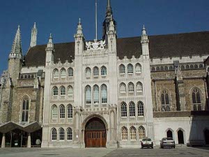 The London Guildhall features gothic spires and a large plaza, deserted on the weekend.
