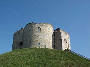 Atop a high grassy hill sits the three story Clifford's Tower, where in 1190 some 150 Jews killed themselves to avoid a rioting party of anti-Semites.