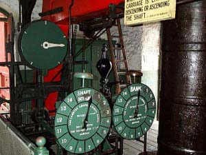 The green dials marked the depth of the car full of coal as it was hoisted to the surface under the vigilant eye of the hoist operator