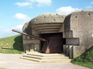The German gun emplacement is protected by a concrete bunker perhaps 8 feet thick, so that a direct hit was needed to disable the gun.