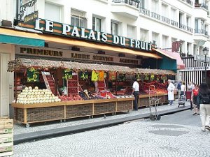 'Le Palais du Fruit on the Rue Montorgueil has carefully arranged bins of fresh fruit in the bins rolled out onto the street
