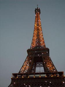 At 10:00 p.m the sky is still light, but the shining lights of the Eiffel Tower give it a lovely yellow orange color