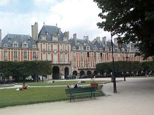 Beautiful (and beautifully kept) four- and five-story red brick town homes front on the elegant Place des Vosges in Paris