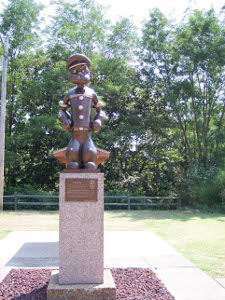 The statue of Popeye is about three feet, on a plinth of the same height