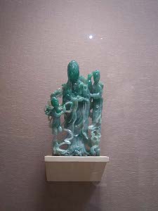 Lovely jade carving representing three figures, a man, woman, and child
