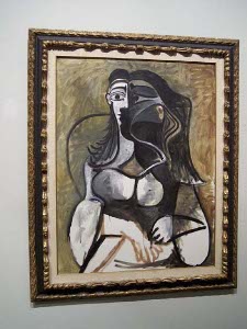 A typical Picasso abstract, in black, beige, olive and white