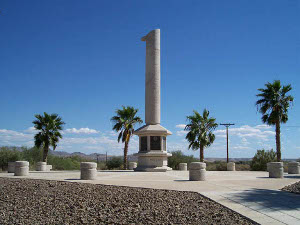 The monument at Poston is an obelisk with a long bronze inscription in six panels at the base, in a plaza surrounded with palms and concrete pillars
