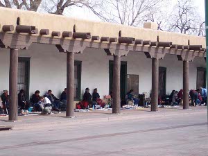 Indian merchants sit around the Santa Fe Plaza, their merchandise on blankets spread out in front of them