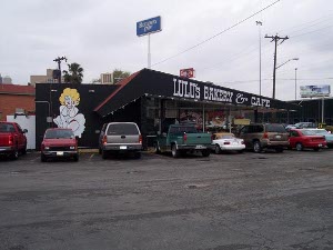 Painted black, with a picture of a blonde holding her skirt down (a takeoff on the famous Marilyn Monroe portrait) Lulu's Cafe parking lot is full.