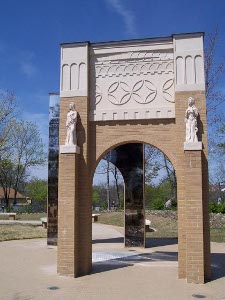 Two arches topped by figures representing different ethnic groups form the memorial for Central High