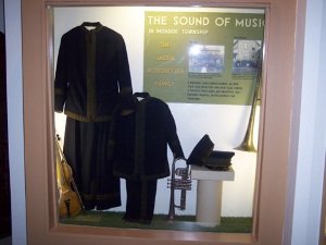 The display shows instruments and uniforms of the Altstaetter Family Band