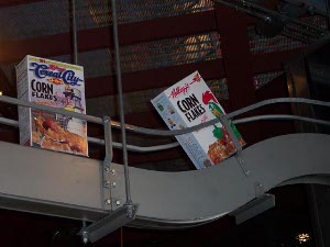 Two boxes of cornflakes on the conveyor belt