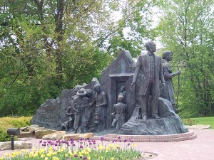 Lifesize bronze statue depicting runaway slaves shepherded North by Michigan abolitionists on the Underground Railroad