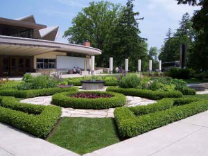Box hedges in a geometric design form a garden at the entrance to the Shakespeare Festival Theater, Stratford, Ontario