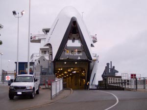 The white Chi-Cheemaun ferry lifts her bow high to allow cars to drive in and out