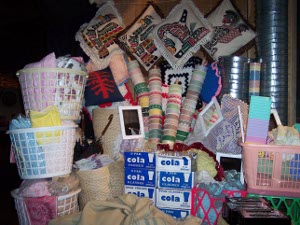 Laundry baskets, soft drinks, dixie cups, etc., illustrate the items brought to a potlatch