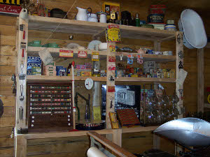 Display shelves hold 1900s items in the Heritage Village General Store reconstruction