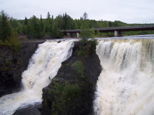 Called the Niagara of the North, the Kakabeka Falls of the Kaministiquia River in Western Ontario divide into two torrents of foamy water.