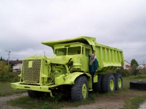 The brilliant chartreuse truck was designed to carry many tons of iron ore