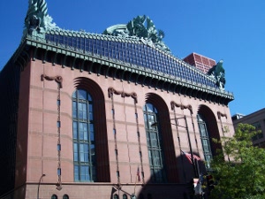 The roof of the Chicago Public Library is topped with a large and ornate green copper sculpture